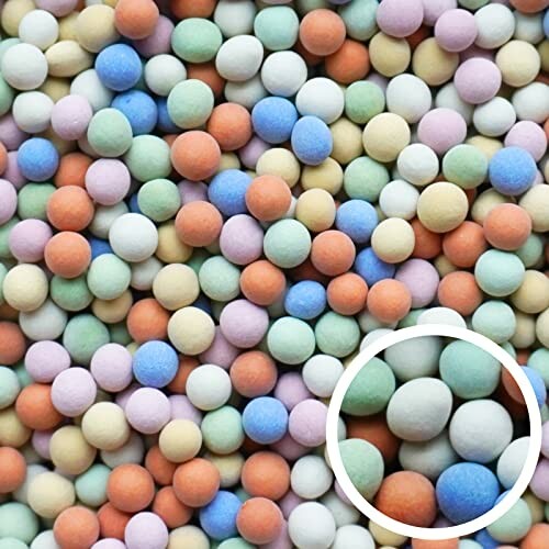Close-up of colorful candy balls in various pastel shades.